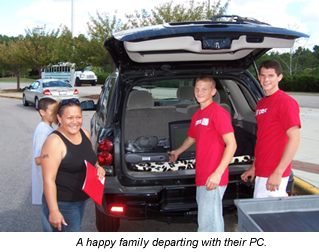 Photo of Family departing with their refurbished PC