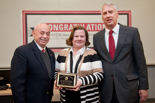 Photo of Tammy Coates, flanked by Dean Martin Vega and John Gilligan.