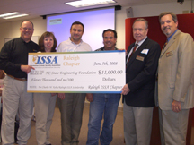 Photo of CSc receiving ISSA Donation Check
